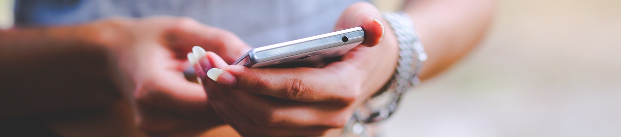 Close-up Photo of a woman's hands using a cell phone